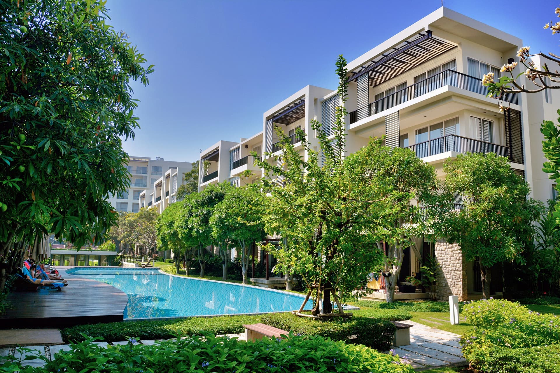 A gated apartment complex with landscaped grounds
